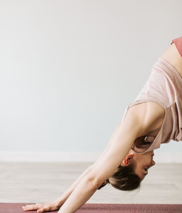 Woman in a calm yoga pose, embodying inner energy and balance.